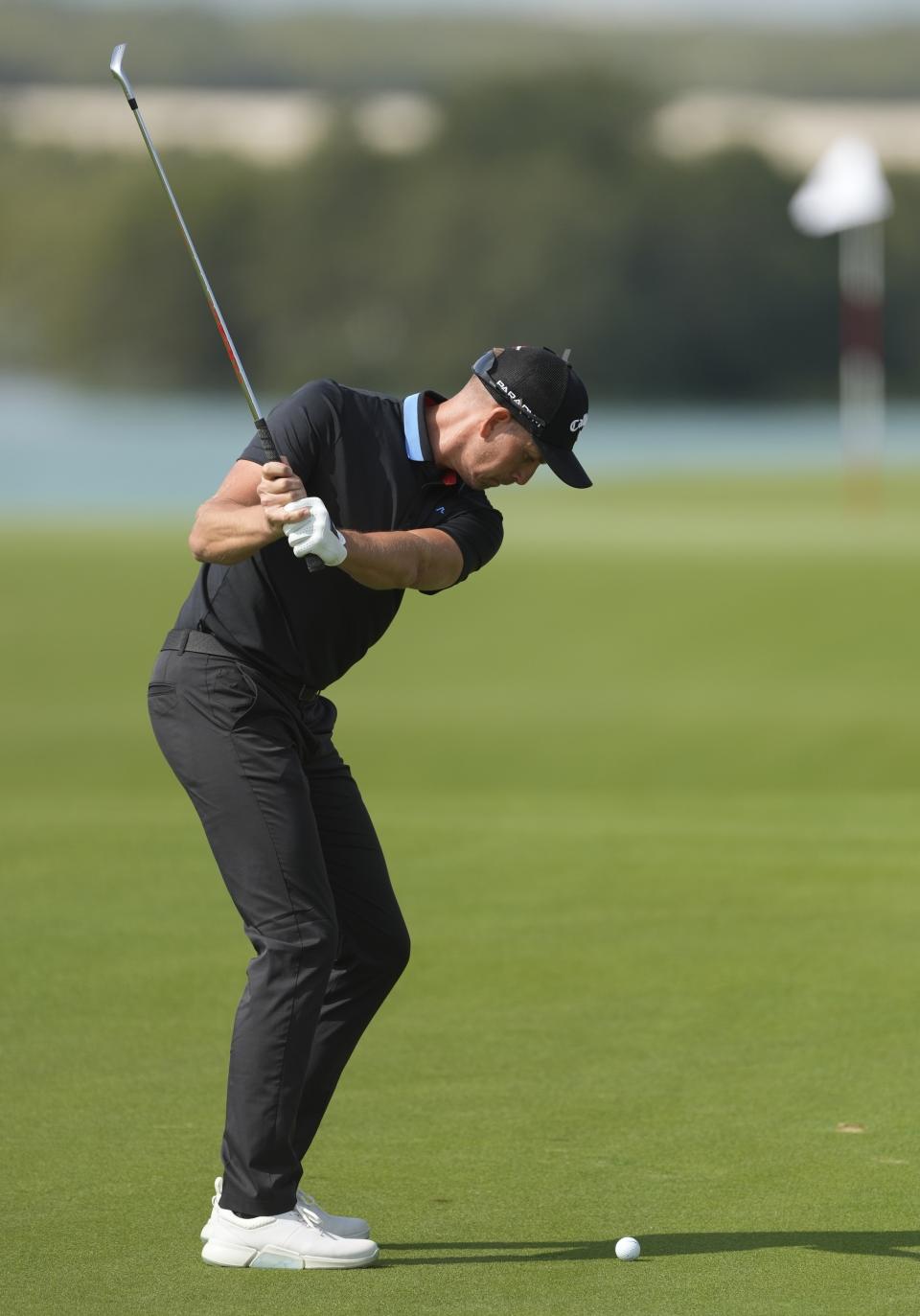 Henrik Stenson of Sweden plays a ball on the 18th hole during the first round of Abu Dhabi HSBC Golf Championship, in Abu Dhabi, United Arab Emirates, Thursday, Jan. 19, 2023. (AP Photo/Kamran Jebreili)