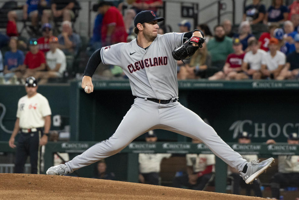 Cleveland Guardians starting pitcher Gavin Williams (63) delivers in the bottom of the first inning in a baseball game in Arlington, Texas, Saturday, July 15, 2023. (AP Photo/Emil T. Lippe)
