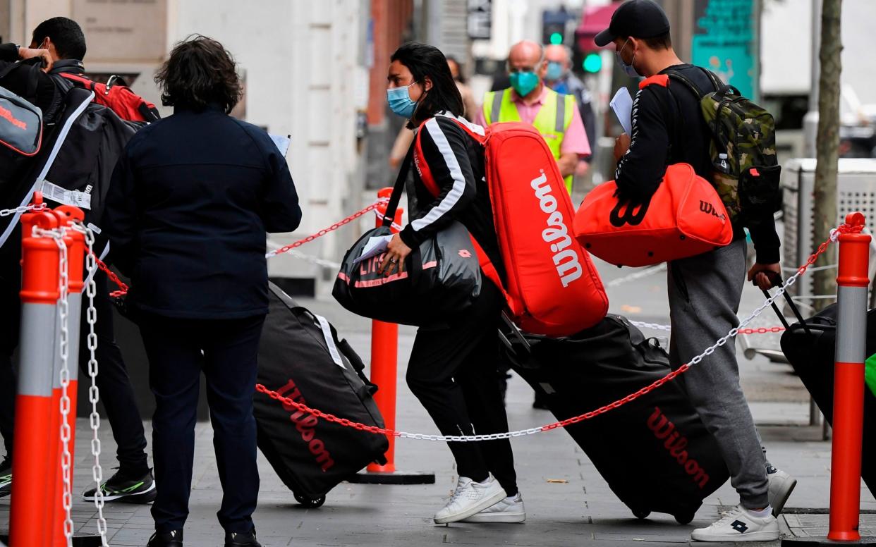 Tennis players, coaches and officials arrive at a hotel in Melbourne on January 15, 2021, before quarantining for two weeks ahead of the Australian Open tennis tournament - Getty Images