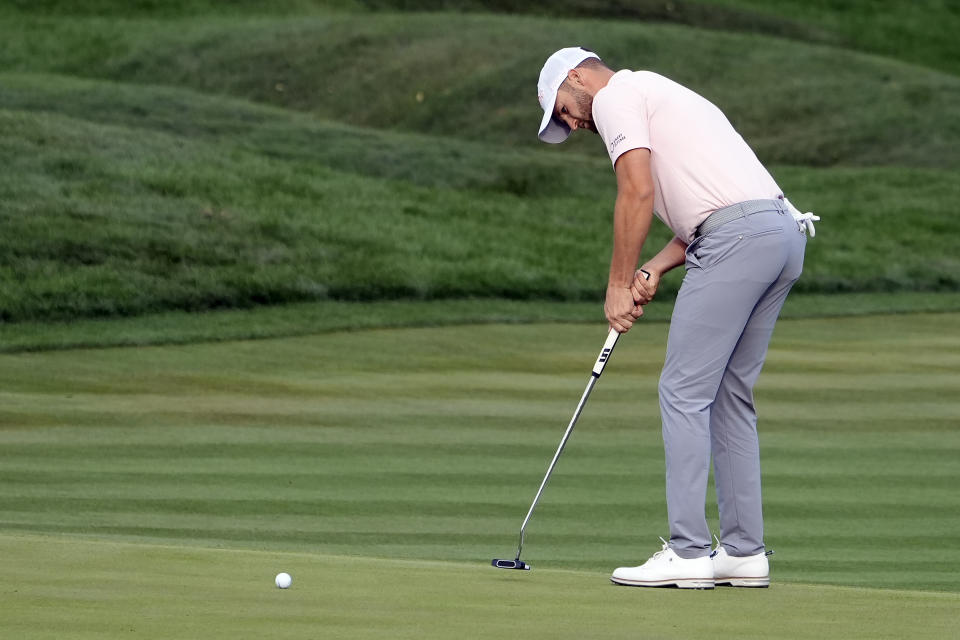 Wyndham Clark putts on the 18th green during the final round of The Players Championship golf tournament Sunday, March 17, 2024, in Ponte Vedra Beach, Fla. (AP Photo/Marta Lavandier)