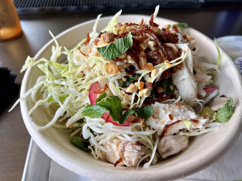 The ESP salad with chicken at East Side Pho in Nashville March 10, 2023, has shredded cabbage, mint, red onion, fried shallots, toasted peanuts and spicy fish sauce
