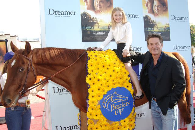<p>Jon Kopaloff/FilmMagic</p> Dakota Fanning and Kurt Russell at the "Dreamer" Los Angeles premiere in 2005