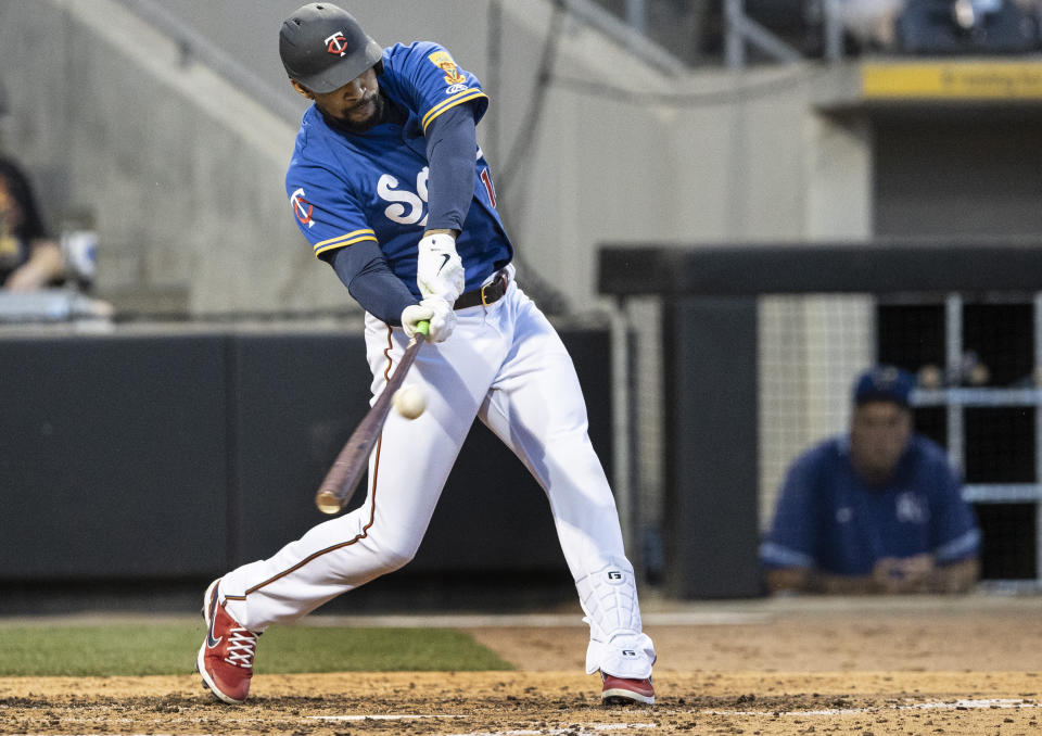 Minnesota Twins' Byron Buxton, playing for the St. Paul Saints, hits a triple in the sixth inning against the Omaha Storm Chasers in a minor league baseball game Tuesday, June 8, 2021, in St. Paul, Minn. Buxton is on a rehab assignment. (Jerry Holt/Star Tribune via AP)