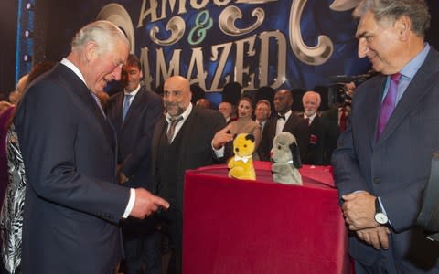 Prince Charles, Prince of Wales meets cast members Omid Djalili, puppets Sooty and Sweep and Jim Carter after attending a one off performance of 'We Are Most Amused and Amazed' in aid of The Prince's Trust - Credit: WPA pool