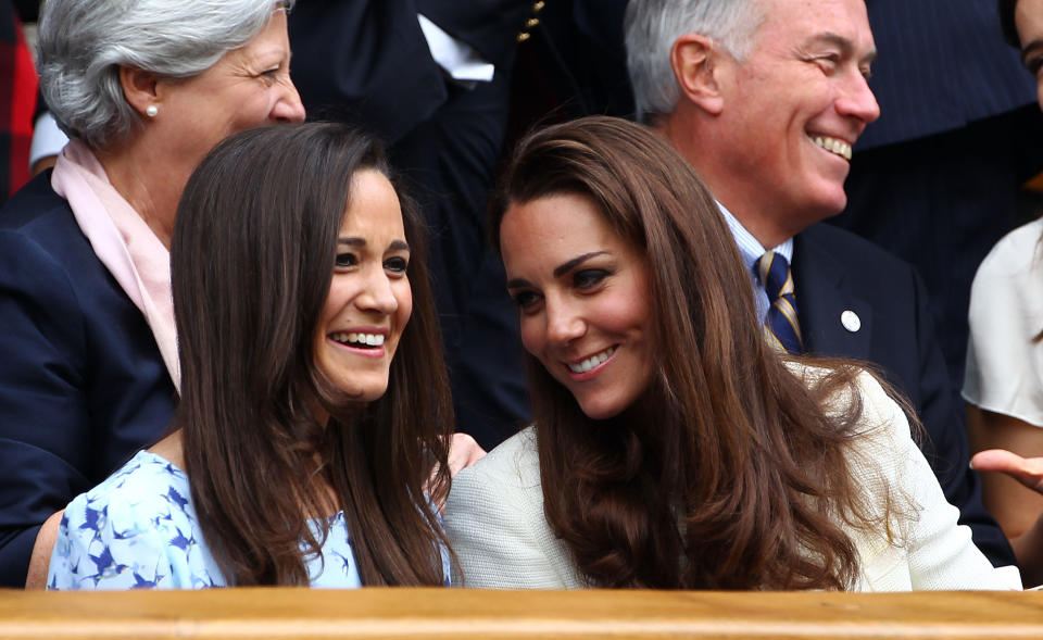 <p>On July 8 2012, the Duchess of Cambridge sat alongside her sister, Pippa Middleton, at Wimbledon. <em>[Photo: Getty]</em> </p>