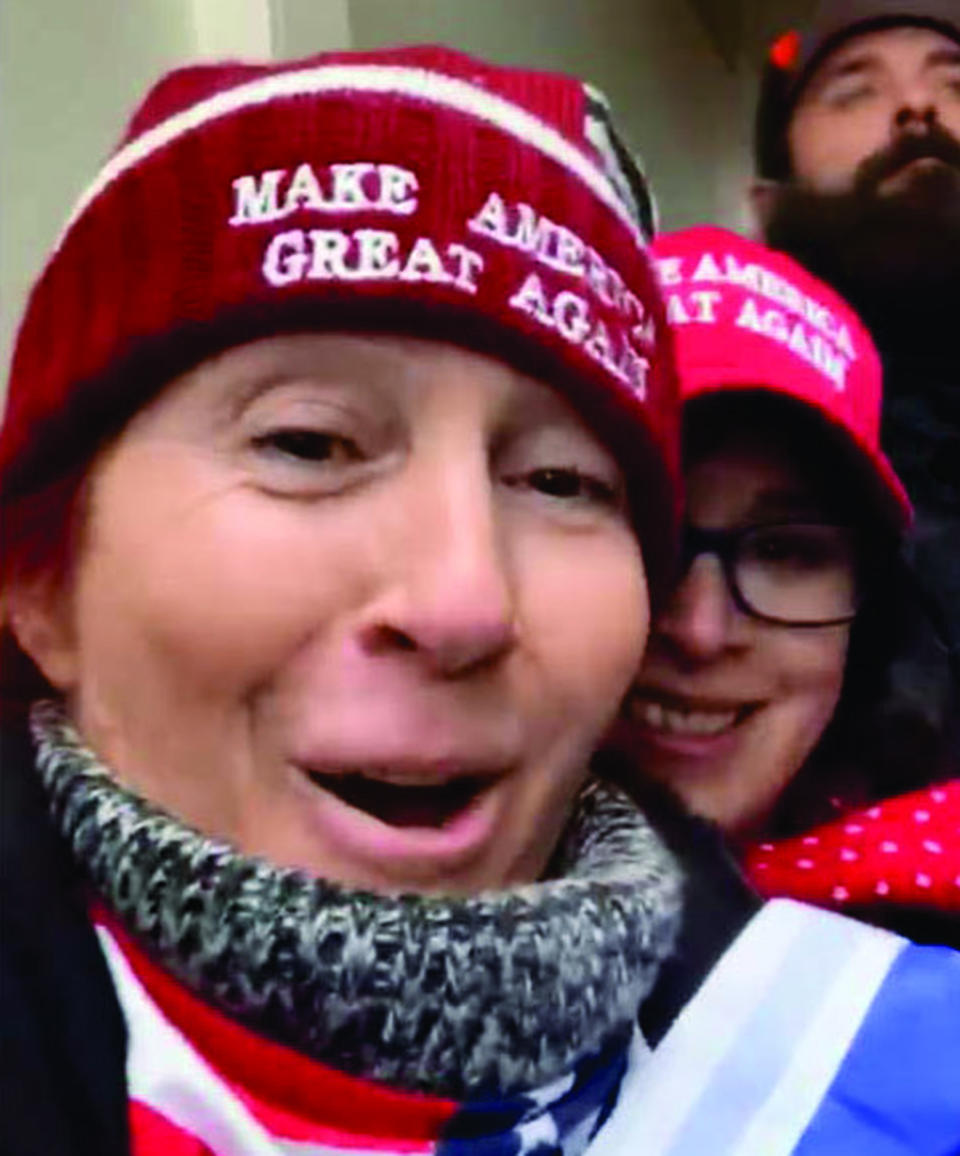 A video screenshot shows both Dawn Bancroft wearing a red 