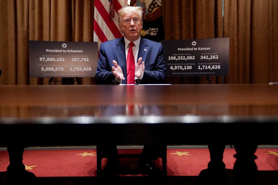 Former President Donald Trump speaks during a meeting with then Arkansas Gov. Asa Hutchinson and Kansas Gov. Laura Kelly in the Cabinet Room of the White House, Wednesday, May 20, 2020, in Washington. (AP Photo/Evan Vucci) ORG XMIT: DCEV325