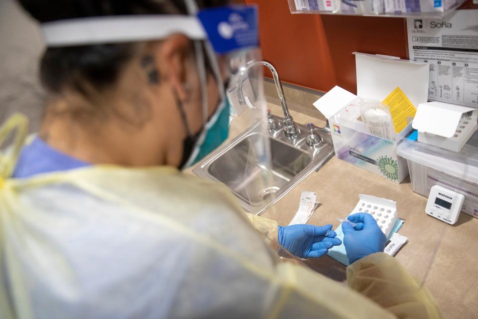 Medical Assistant Melissa Estrada prepares a COVID-19 antigen test at Lancaster Family Health Center in Salem, Oregon on Thursday, Aug. 19, 2021. 