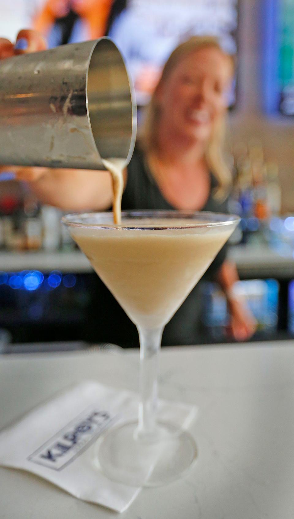 Bartender Caitlin Maloney pours an espresso martini at Kilroy's in Quincy on Monday, July 17, 2023.