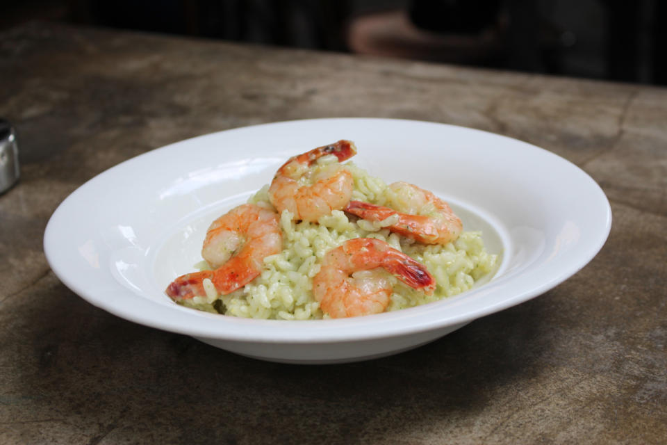 Another dish on the cheese wheel menu is the risotto ($26) with tiger prawns that is drizzled with basil pesto. (Photo: Yahoo Singapore)