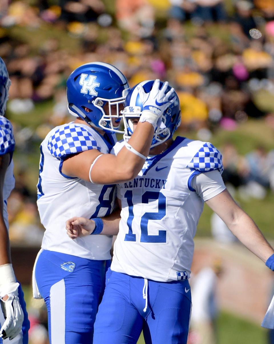 Kentucky Wildcats kicker Chance Poore (12) is congratulated by punter Grant McKinniss (86) after Poore's field goal during the first half against the Missouri Tigers at Memorial Stadium/Faurot Field.