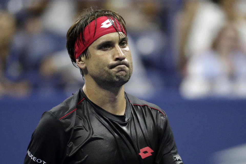 David Ferrer, of Spain, reacts after losing a point to Rafael Nadal, also of Spain, during the first round of the U.S. Open tennis tournament, Monday, Aug. 27, 2018, in New York. (AP Photo/Julio Cortez)