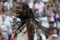 Dustin Brown of Germany celebrates a point during his match against Rafael Nadal of Spain at the Wimbledon Tennis Championships in London, July 2, 2015. REUTERS/Stefan Wermuth