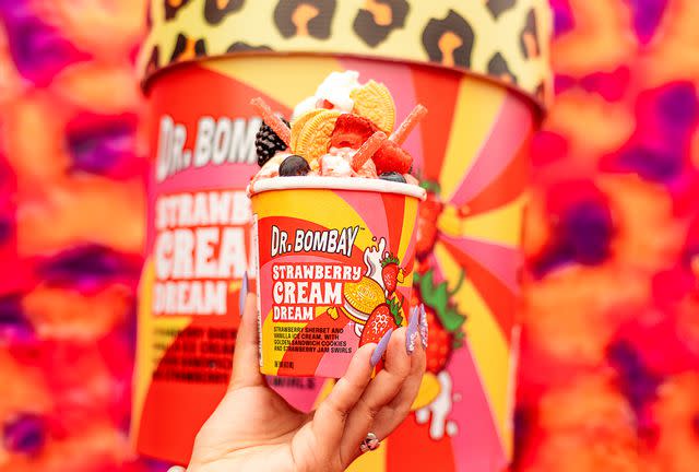 <p>Snoop Dogg / Dr. Bombay Ice Cream</p> Snoop Dogg's latest Dr. Bombay ice cream flavor is a combination of strawberry sherbet, vanilla ice cream, strawberry jam swirls, and pieces of golden sandwich cookies.