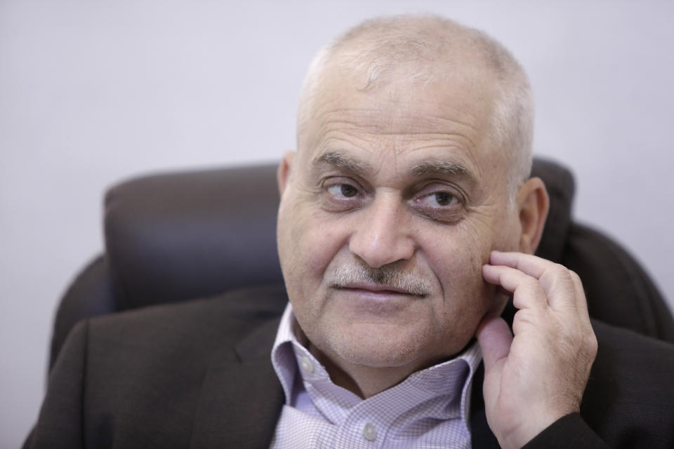 Lebanese Health Minister Jamil Jabak speaks during an interview at his private clinic in a southern suburb of Beirut, Lebanon, Saturday, May 18, 2019. Jabak says he has "overcome" U.S. concerns over the possibility of his ministry's finances going to the Hezbollah militant group, by gaining public trust and ensuring transparency. (AP Photo/Hassan Ammar)