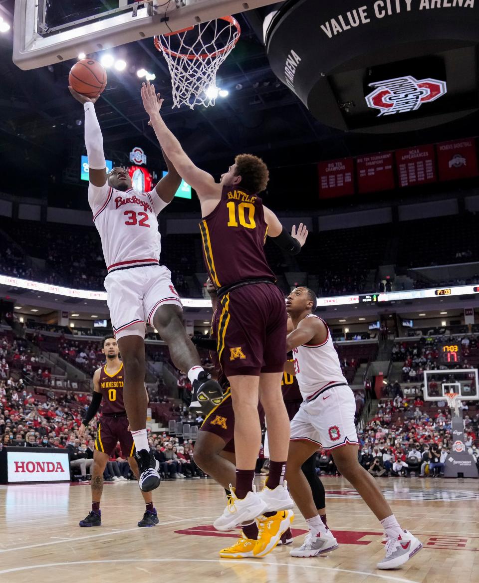 Ohio State Buckeyes forward E.J. Liddell (32) shoots over Minnesota Golden Gophers forward Jamison Battle (10) during the first half of the NCAA men's basketball game at Value City Arena in Columbus on Tuesday, Feb. 15, 2022.