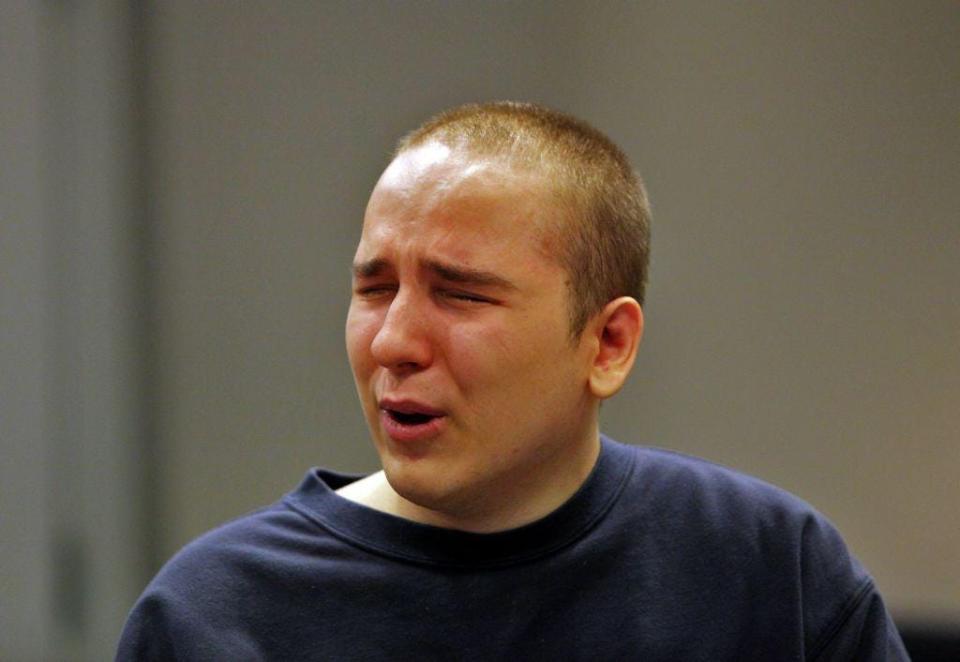 Victor Razumov cries as he testifies during a hearing to determine his competency to stand trial in state Superior Court in Newton on July 19, 2018.