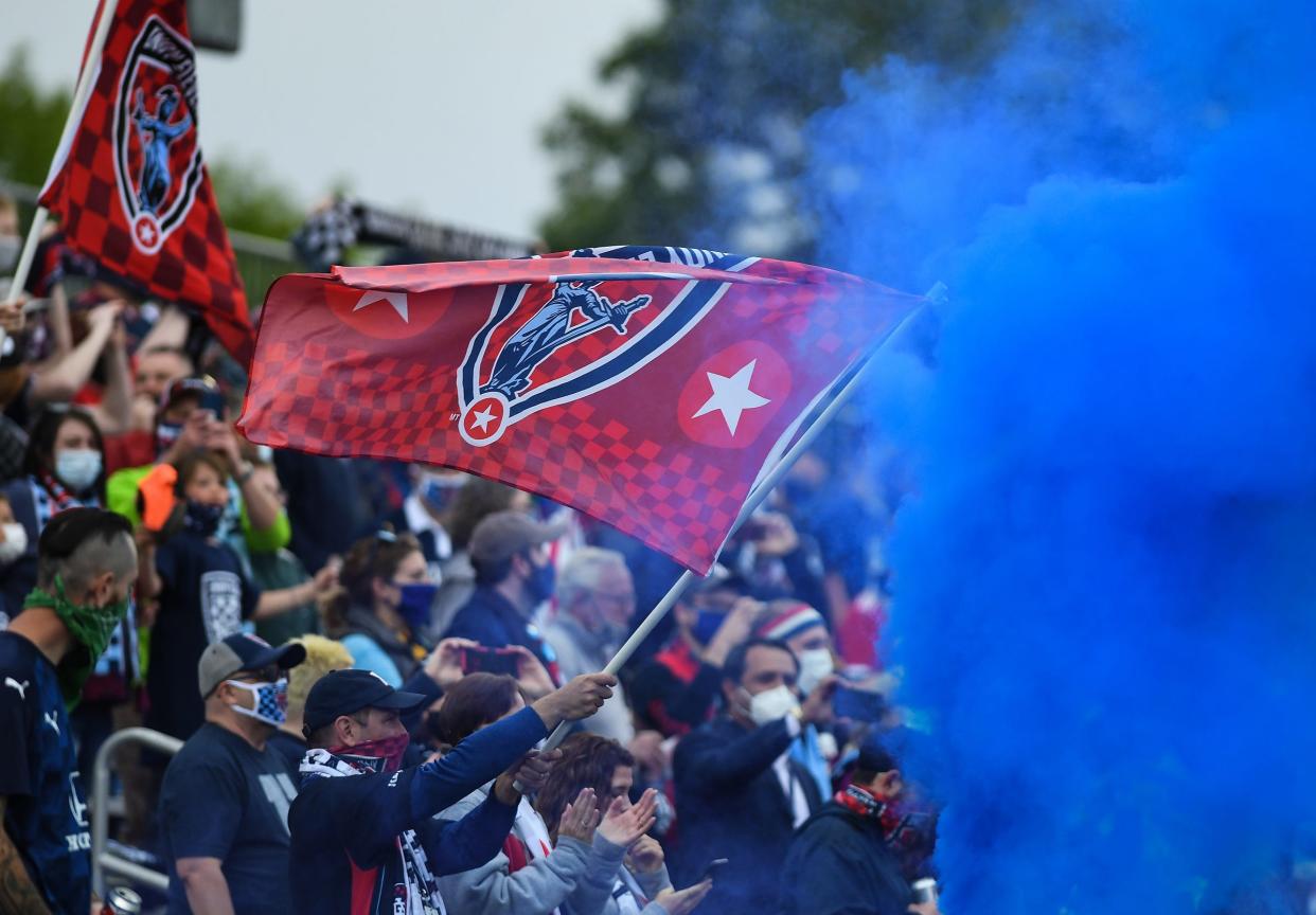 Brickyard Battalion fans celebrate kick-off with a smoke bomb at IUPUI's Carroll Stadium, in a May 2021 file photo.