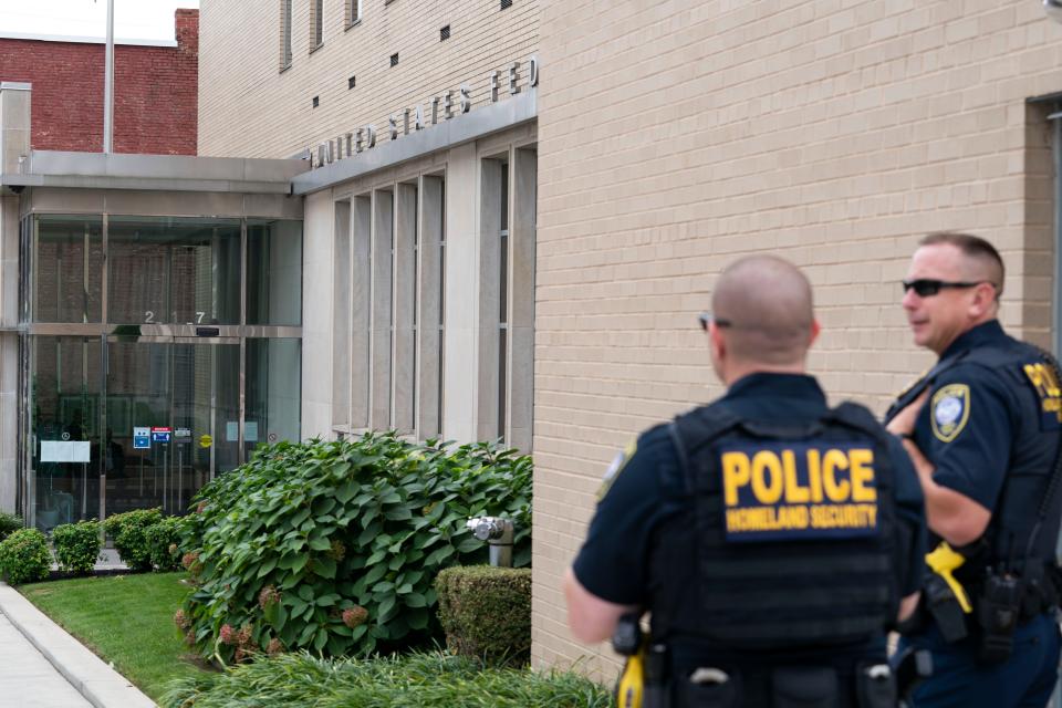 Homeland Security police officers stand outside the U.S. District Courthouse where Jonathan and Diana Toebbe had their hearing in Martinsburg, W.Va., Oct. 12, 2021.