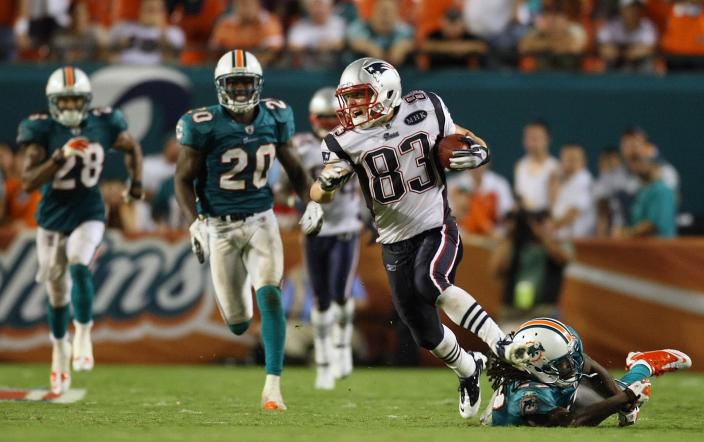 Receiver Wes Welker scores on a 99-yard reception from Tom Brady.