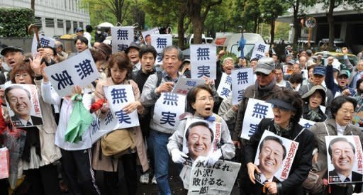 Supporters of former Democratic Party of Japan leader Ichiro Ozawa, seen here gathering at an entrance to the Tokyo District Court, on April 26. Ozawa, one of the most powerful men in Japanese politics was found not guilty of a major funding scandal, paving the way for a possible showdown with the ruling party leadership