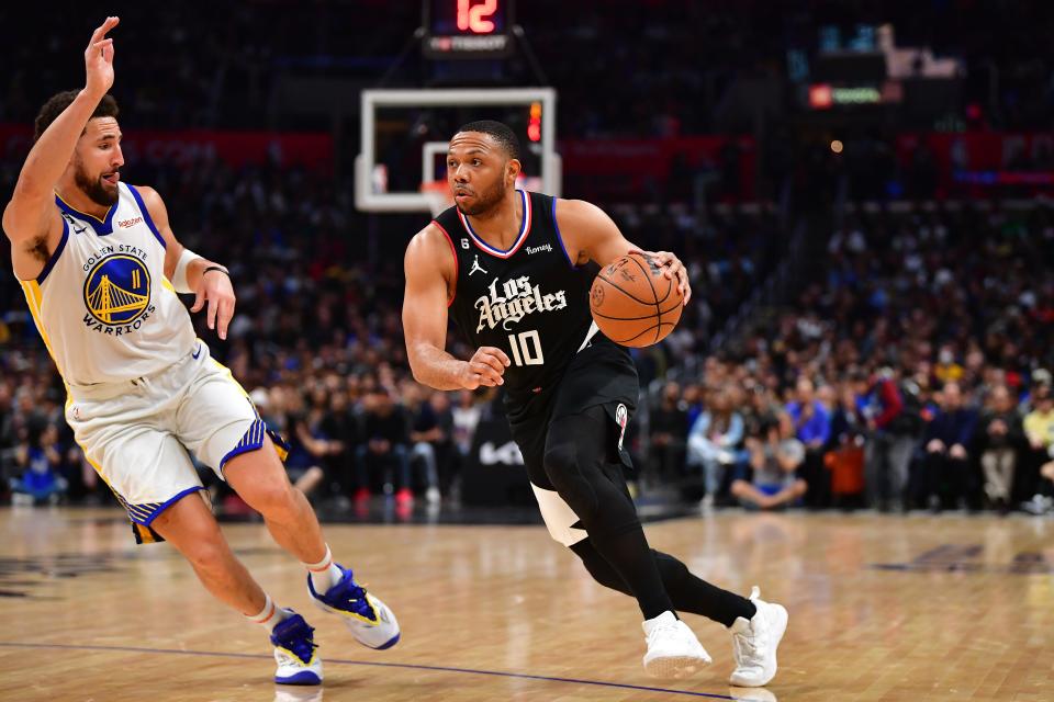 Eric Gordon works against Golden State Warriors guard Klay Thompson (11) during a Los Angeles Clippers game on March 15, 2023.