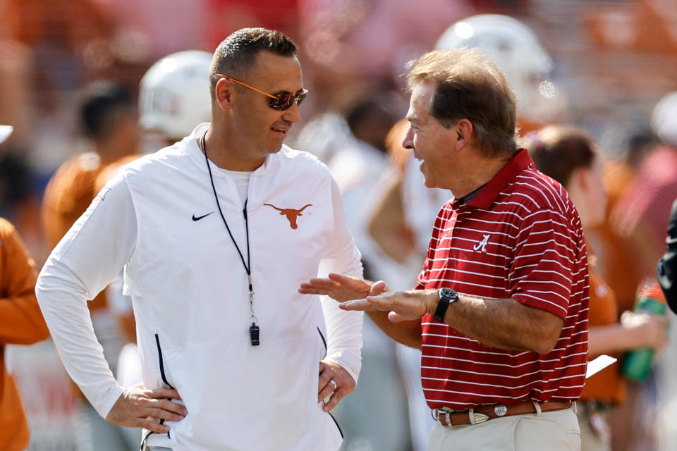 AUSTIN, TEXAS - SEPTEMBER 10: Head coach Steve Sarkisian of the Texas Longhorns talks with head coach Nick Saban of the Alabama Crimson Tide before the game at Darrell K Royal-Texas Memorial Stadium on September 10, 2022 in Austin, Texas. (Photo by Tim Warner/Getty Images)