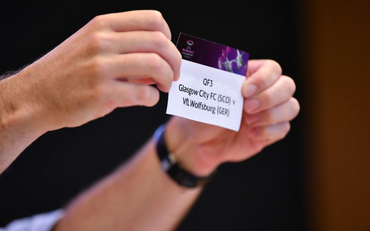 The card of QF3 Glasgow City FC v VfL Wolfsburg is drawn out during the UEFA Women's Champions League - Getty Images