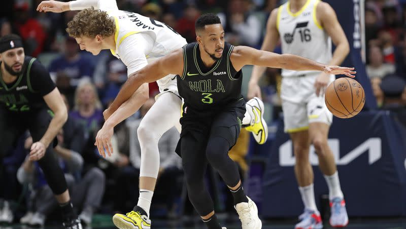 New Orleans Pelicans guard CJ McCollum (3) steals the ball from Utah Jazz forward Lauri Markkanen (23) during the first half of an NBA basketball game in New Orleans, Tuesday, Jan. 23, 2024.