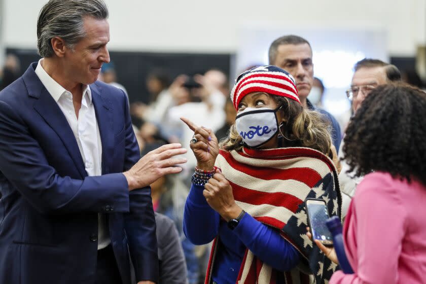 Long Beach, CA, Sunday, November 6, 2022 - Dr. Jennifer Robinson chats with California Governor Gavin Newsom at a rally endorsing ballot proposition 1 at Long Beach City College. (Robert Gauthier/Los Angeles Times)