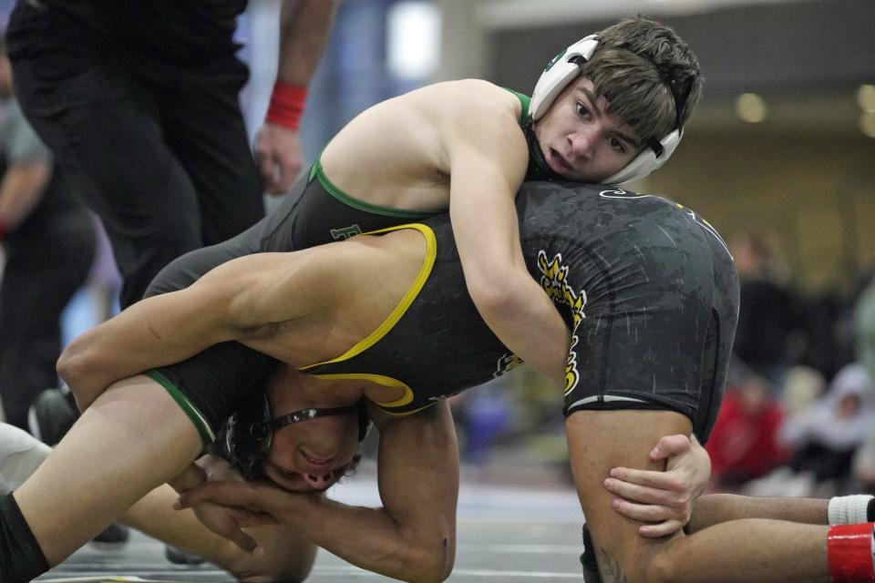 Ponaganset's Jared Hood, shown competing against Central's Cameron Davis, won the match to keep his record against in-state opponents perfect for his career.