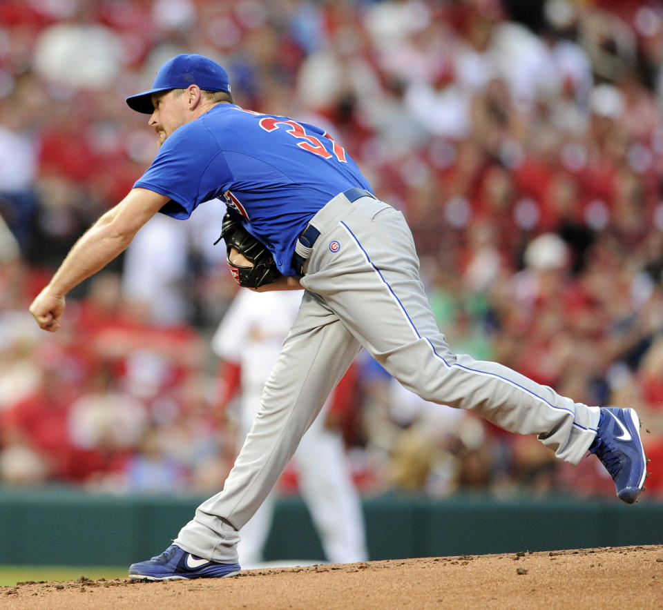 Chicago Cubs' starting pitcher Travis Wood throws against the St. Louis Cardinals in the first inning in a baseball game, Monday, May 12, 2014, at Busch Stadium in St. Louis. (AP Photo/Bill Boyce)