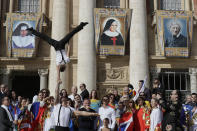 Participants at the Italian International Circus festival perform for Pope Francis during his weekly general audience, in St.Peter's Square, at the Vatican, Wednesday, Oct. 16, 2019. (AP Photo/Andrew Medichini)