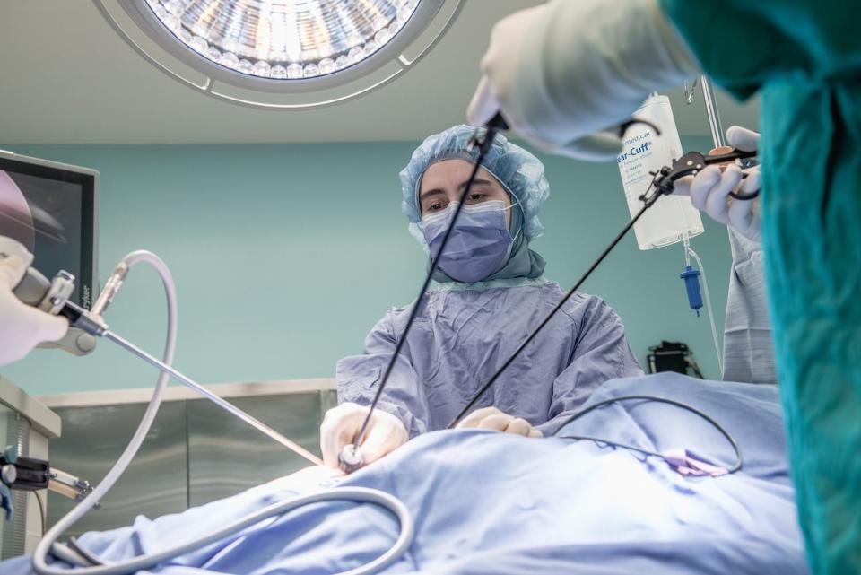 Doctor Ahmed Nasr performs mock laparoscopic surgery with two nurses in this undated photo.