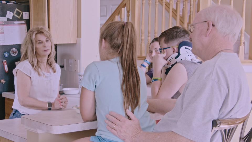 This scene from the documentary "The Fire That Took Her" shows a difficult conversation that Bonnie Bowes, left, had with her granddaughters about their mother Judy Malinowski. Malinowski was a victim of domestic violence who died in 2017, two years after her boyfriend set her on fire during a violent confrontation outside a Gahanna, Ohio, convenience store.