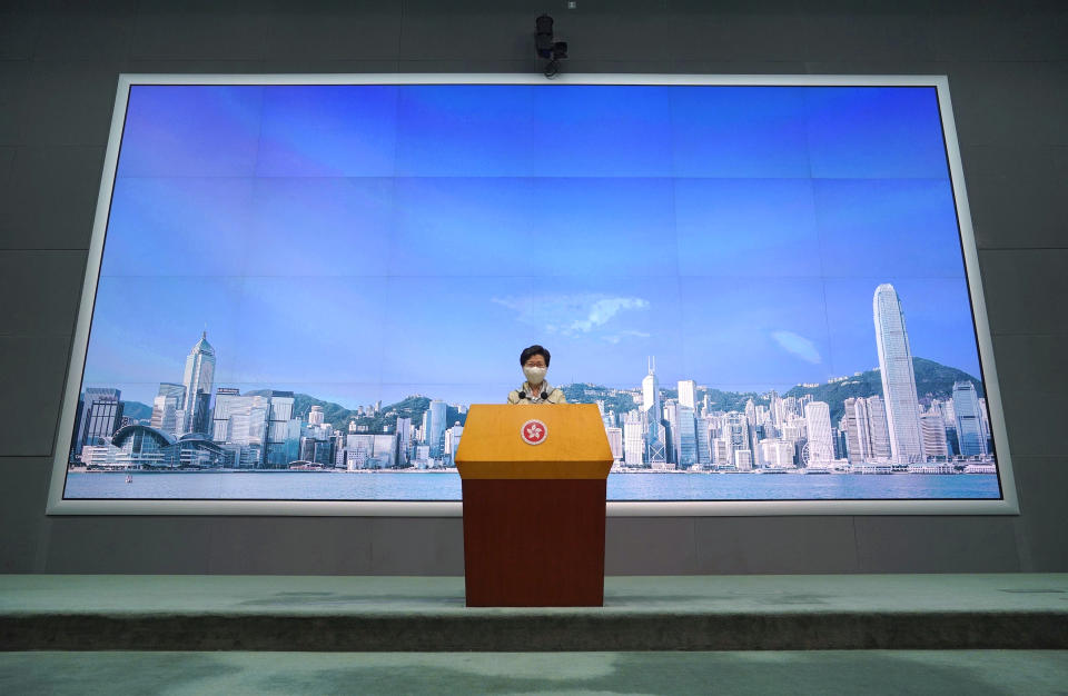 Hong Kong Chief Executive Carrie Lam listens to reporter's question during a press conference in Hong Kong, Tuesday, June 30, 2020. Hong Kong media are reporting that China has approved a contentious law that would allow authorities to crack down on subversive and secessionist activity in Hong Kong, sparking fears that it would be used to curb opposition voices in the semi-autonomous territory.(AP Photo/Vincent Yu)