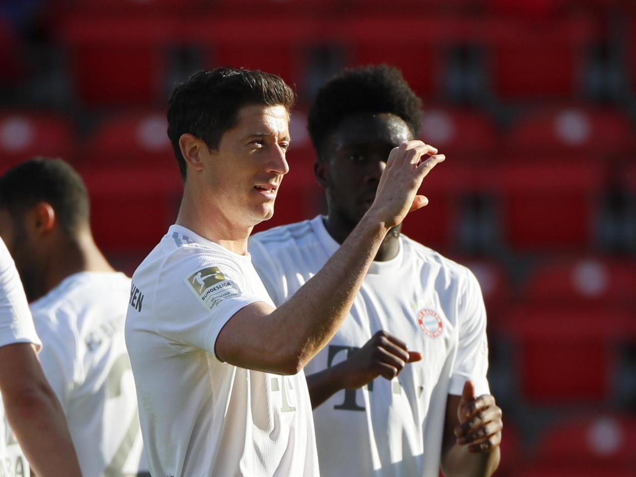 Robert Lewandowski of Bayern Munich celebrates: Hannibal Hanschke/Pool via Getty