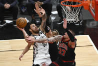 Brooklyn Nets guard Mike James (55) shoots pst Chicago Bulls center Daniel Theis (27) during the second half of an NBA basketball game Tuesday, May 11, 2021, in Chicago. (AP Photo/Matt Marton)