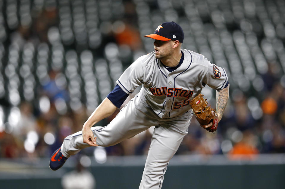 Houston Astros relief pitcher Ryan Pressly follows through on a pitch to the Baltimore Orioles in the ninth inning of the second baseball game of a doubleheader, Saturday, Sept. 29, 2018, in Baltimore. Houston won 5-2. (AP Photo/Patrick Semansky)