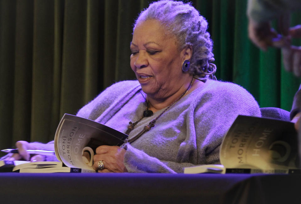 Author Toni Morrison signs copies of her latest book "Home," during Google's online program series, Authors At Google, on Wednesday, Feb. 27, 2013 in New York. (AP Photo/Bebeto Matthews)