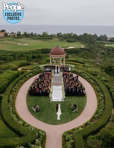 <p>Lisa Ziesing for Abby Jiu Photography</p> Maisa Hallum walks down the aisle to marry Marcus Smart