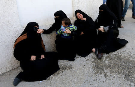 Palestinians react at a hospital following an explosion in the southern Gaza Strip, April 14, 2018. REUTERS/Ibraheem Abu Mustafa