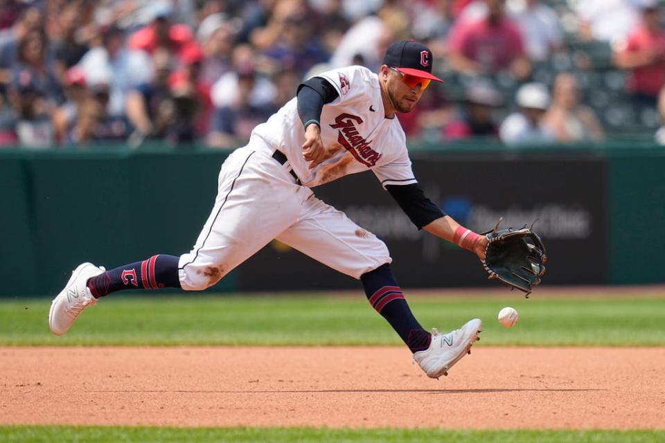 Cleveland Guardians third baseman Tyler Freeman fields a ground ball hit for an infield single by Kansas City Royals' Freddy Fermin in the fourth inning of a baseball game Wednesday, July 26, 2023, in Cleveland. (AP Photo/Sue Ogrocki)