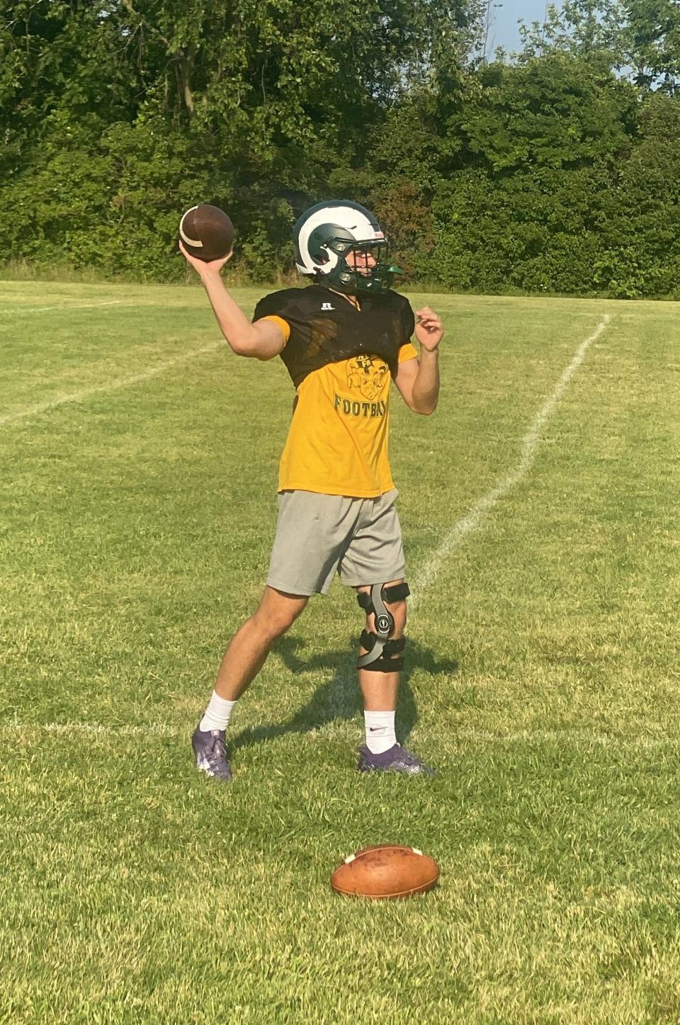 Graham Junge throws passes during a recent Flat Rock football practice.