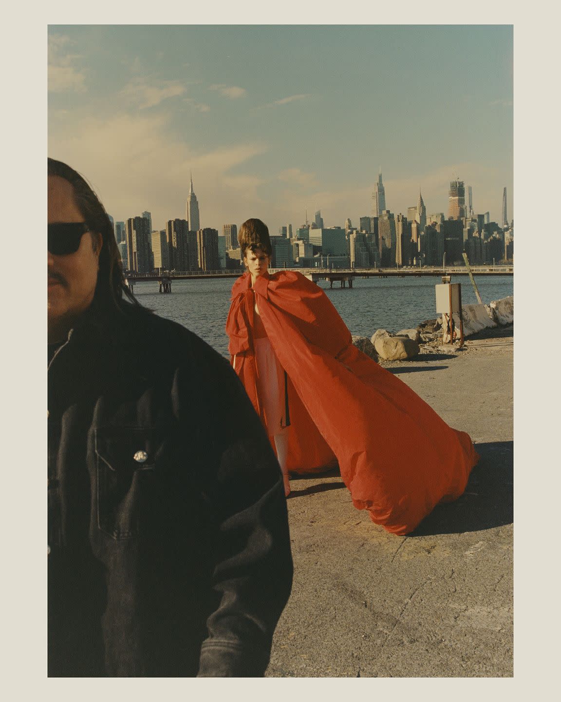 a man wearing a jacket and sunglasses