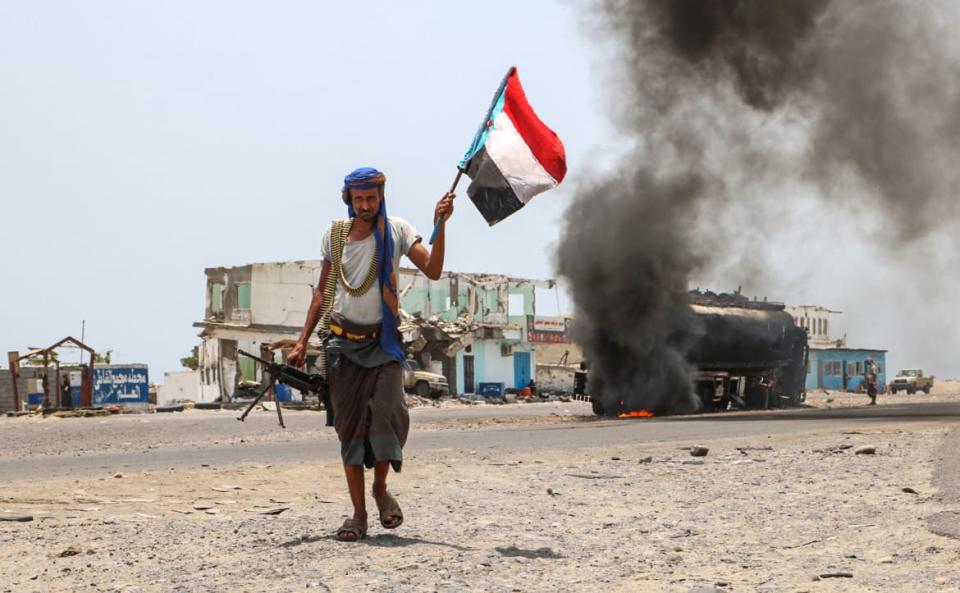 <div class="inline-image__caption"><p>A fighter of the UAE-trained Security Belt Force walks with a separatist flag past an oil tanker set ablaze during clashes between the separatists and the Saudi-backed government forces at the Fayush-Alam crossroads in southern Yemen on Aug. 30, 2019.</p></div> <div class="inline-image__credit">Nabil Hasan/AFP via Getty Images</div>