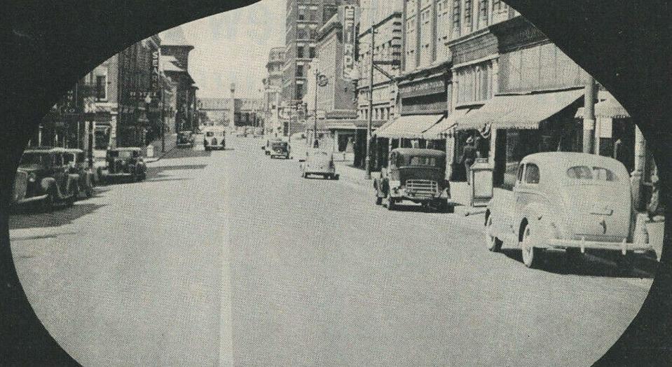 In this undated photo taken on the 200 block of North Front Street looking north to Grace, you can see signs for both Sears (to the left) and Efird's department stores.