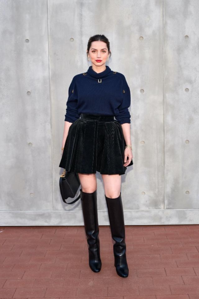 Chloe Grace Moretz looks edgy in a black leather miniskirt at the Louis  Vuitton pre-fall 2023 show