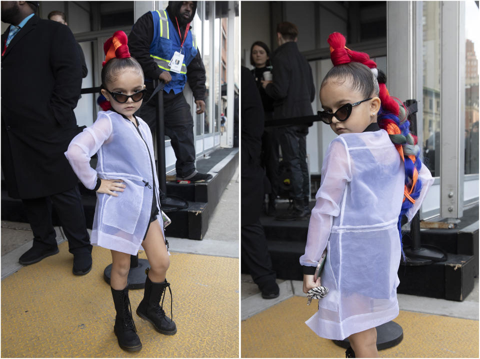 Taylen Biggs, 6, poses for photos outside of a show during Fashion Week, Wednesday, Feb. 12, 2020, in New York. (AP Photo/Mark Lennihan)