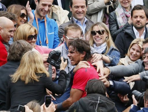 Spain's Rafael Nadal celebrates with his family after winning his seventh French Open final in Paris on June 11. Nadal clinched the record title on Monday, defeating world number one Novak Djokovic 6-4, 6-3, 2-6, 7-5 and shattering the Serb's dream of Grand Slam history